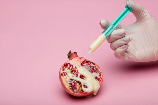 pomegranate being injected with artificial flavoring